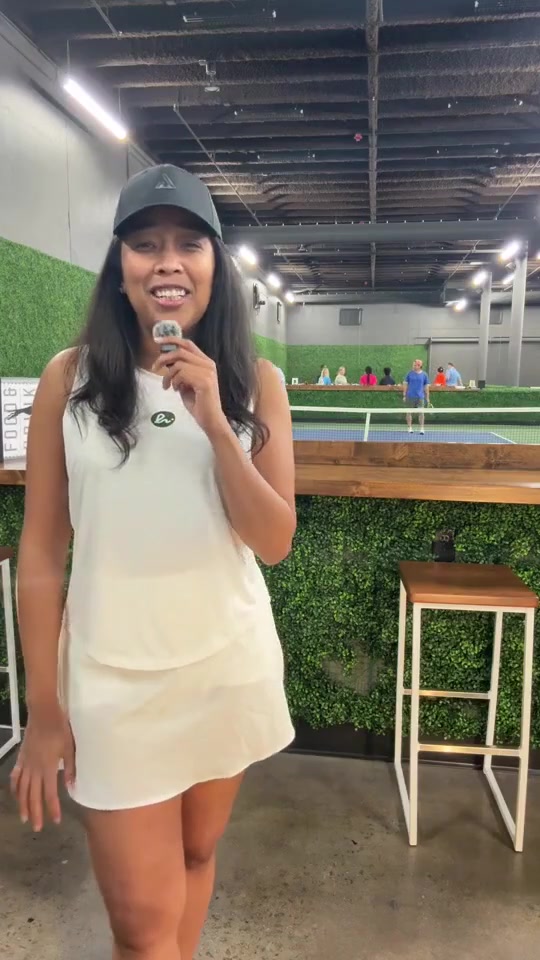 Lauren Bush holding a microphone during a live league night.